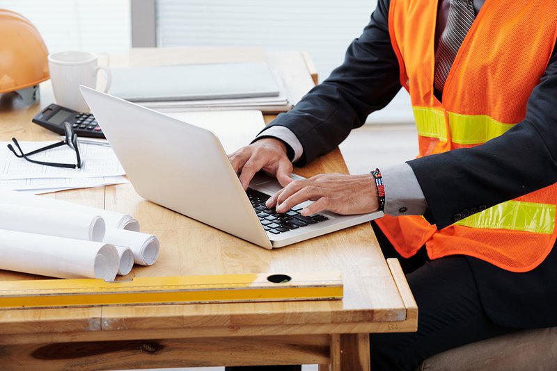 unrecognizable-man-neon-safety-vest-business.max-800x600